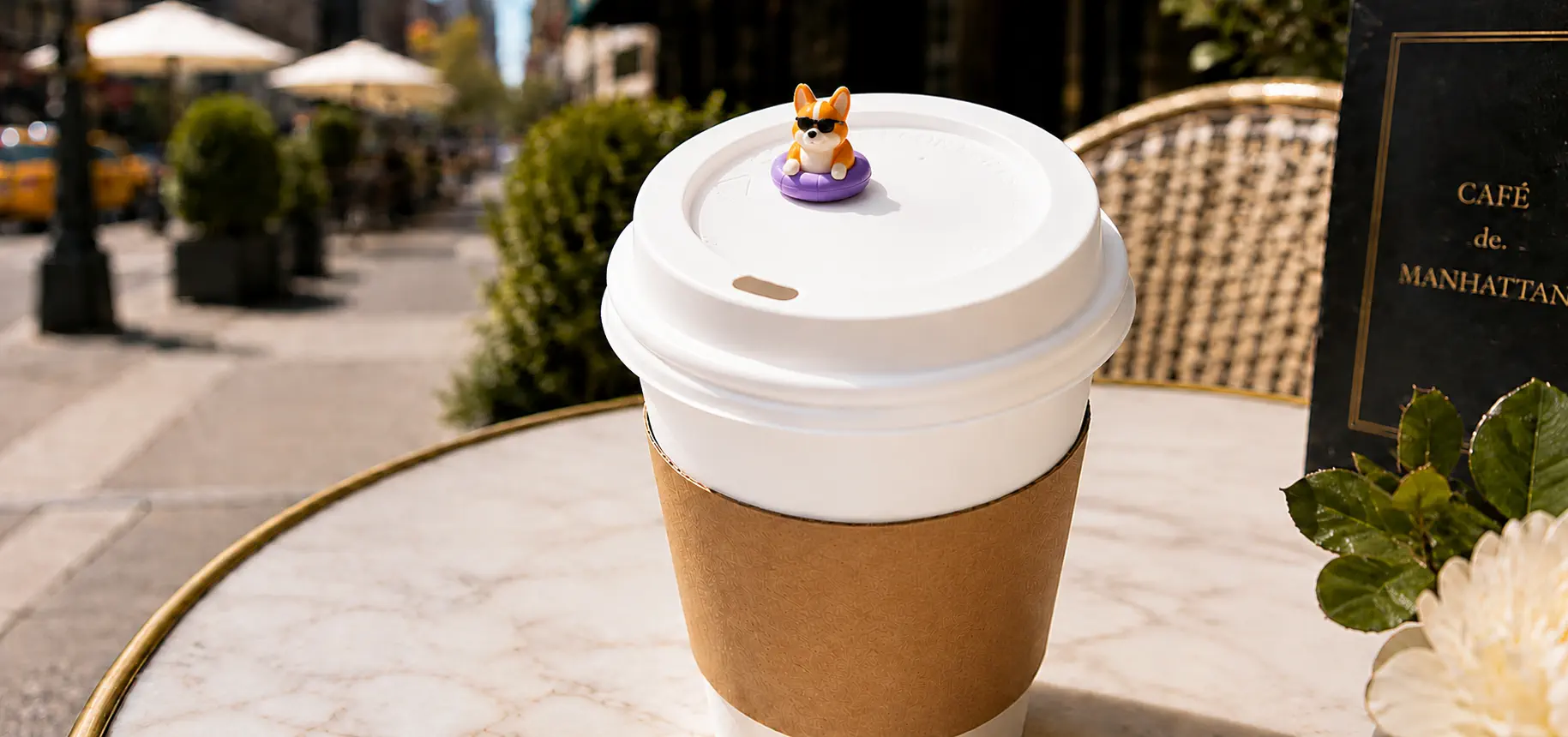 Coffee cup with an Avalia collectible figure on the lid